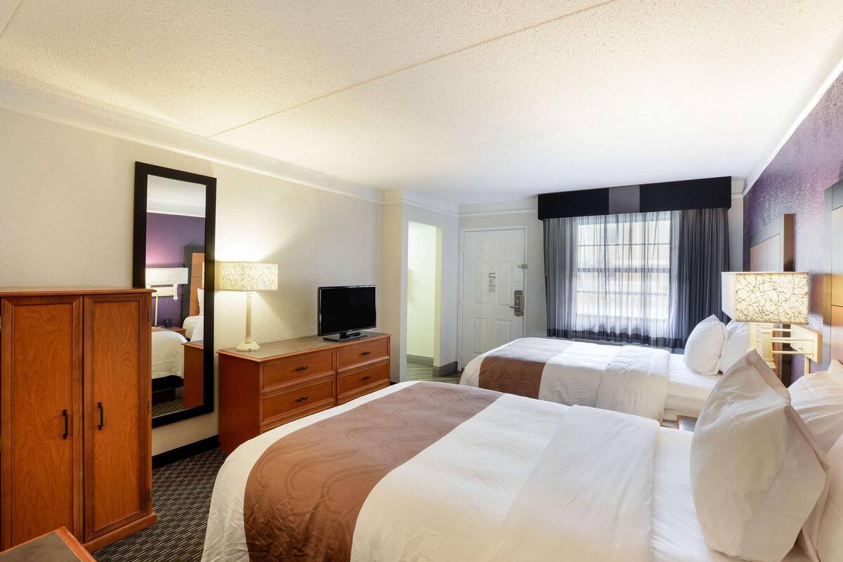 Premium bedding, desk, laptop workspace, iron/ironing board