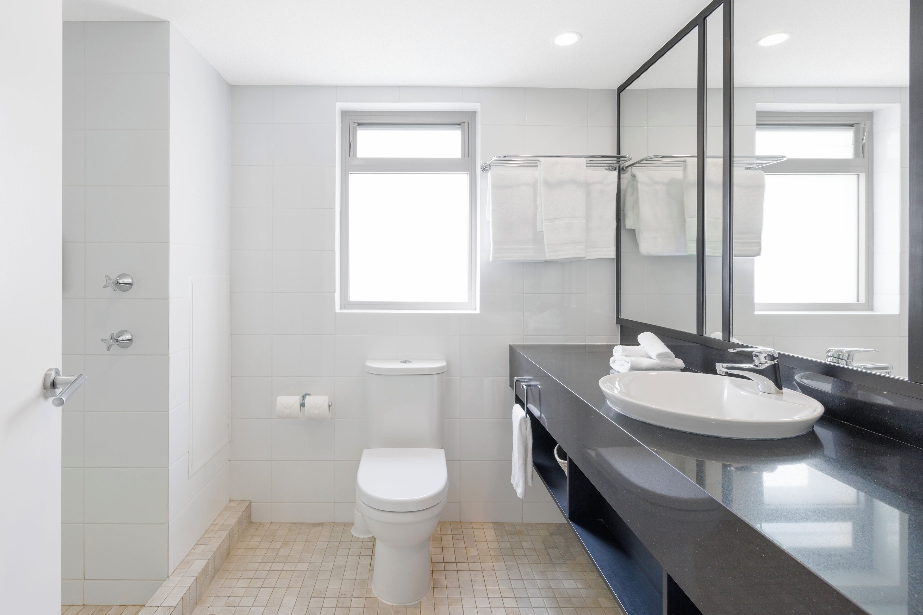 deluxe studio | bathroom | shower, hair dryer, towels, soap