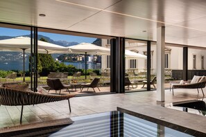 Indoor pool, open 8:00 AM to 8:00 PM, pool loungers