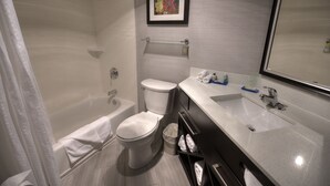 A modern bathroom with a bathtub, toilet, and sink. - Holiday Inn Express Janesville - I-90 & US Hwy 14 by IHG (Janesville)