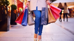 A person holding shopping bags.