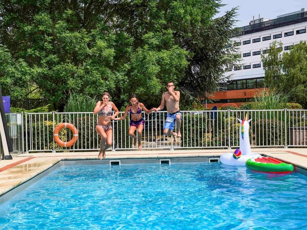 Seasonal outdoor pool, open 10:00 AM to 9:00 PM, sun loungers