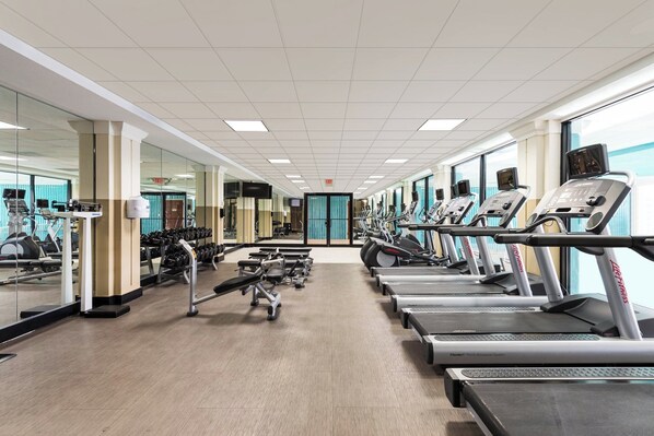 A gym with treadmills, dumbbells, and weight machines. - Crowne Plaza Newark Airport by IHG (Elizabeth)