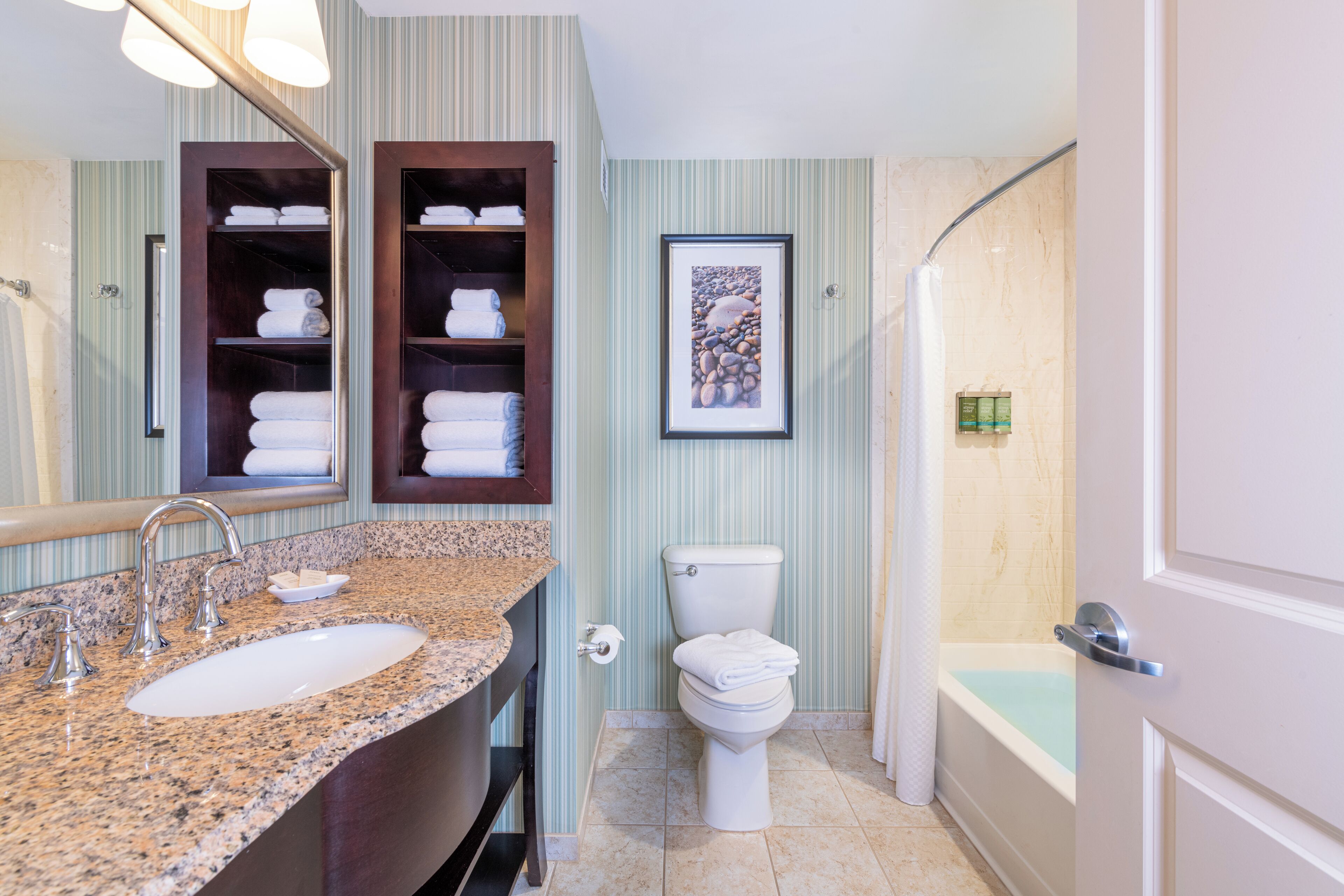 eco-friendly toiletries, hair dryer, towels