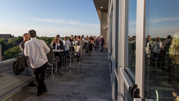 An outdoor terrace with tables and chairs, overlooking a cityscape. - The Strathallan Rochester Hotel & Spa, Tapestry by Hilton (Rochester)