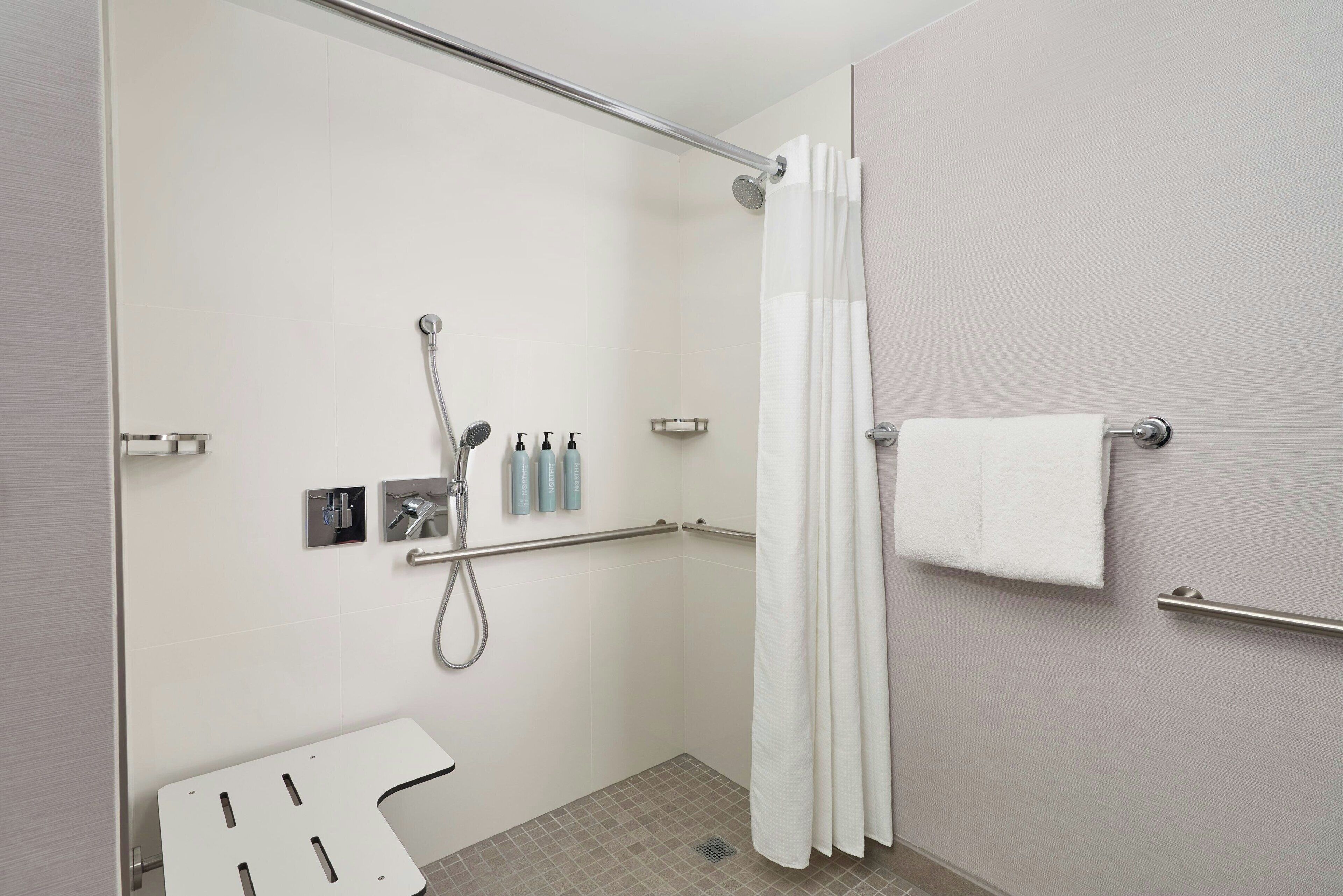 combined shower/bathtub, free toiletries, hair dryer, towels