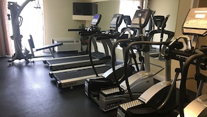 A gym with multiple treadmills, ellipticals, and a stationary bike. - Clarion Hotel Fort Mill Near Amusement Park (Fort Mill)