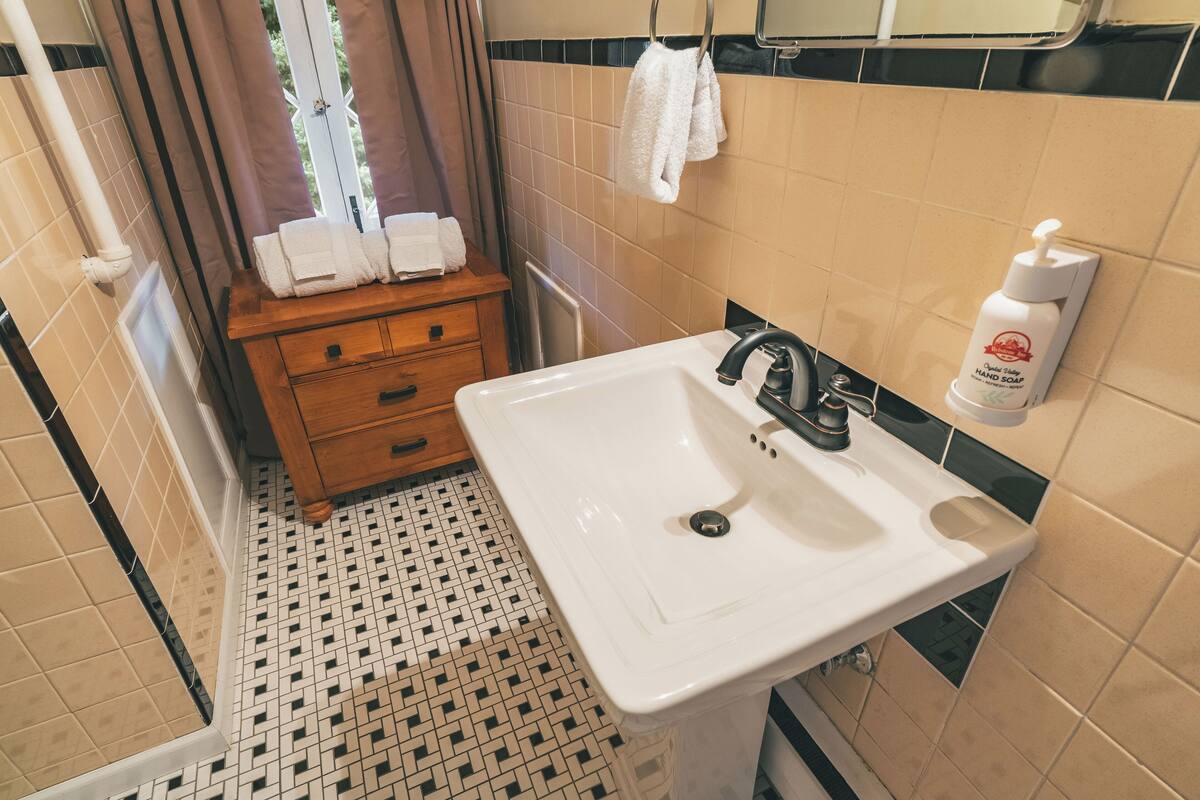 standard double room single use, multiple beds | bathroom | combined shower/bathtub, hair dryer, towels, soap