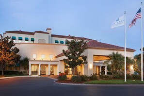 Welcome to our hotel, featuring a modern architectural style with a flat roof and symmetrical facade.