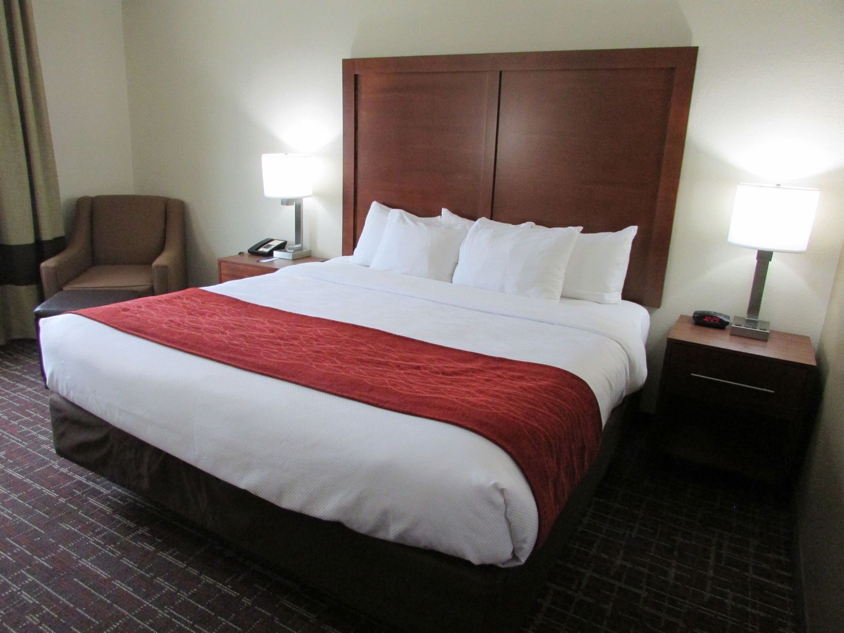 Premium bedding, desk, laptop workspace, blackout drapes