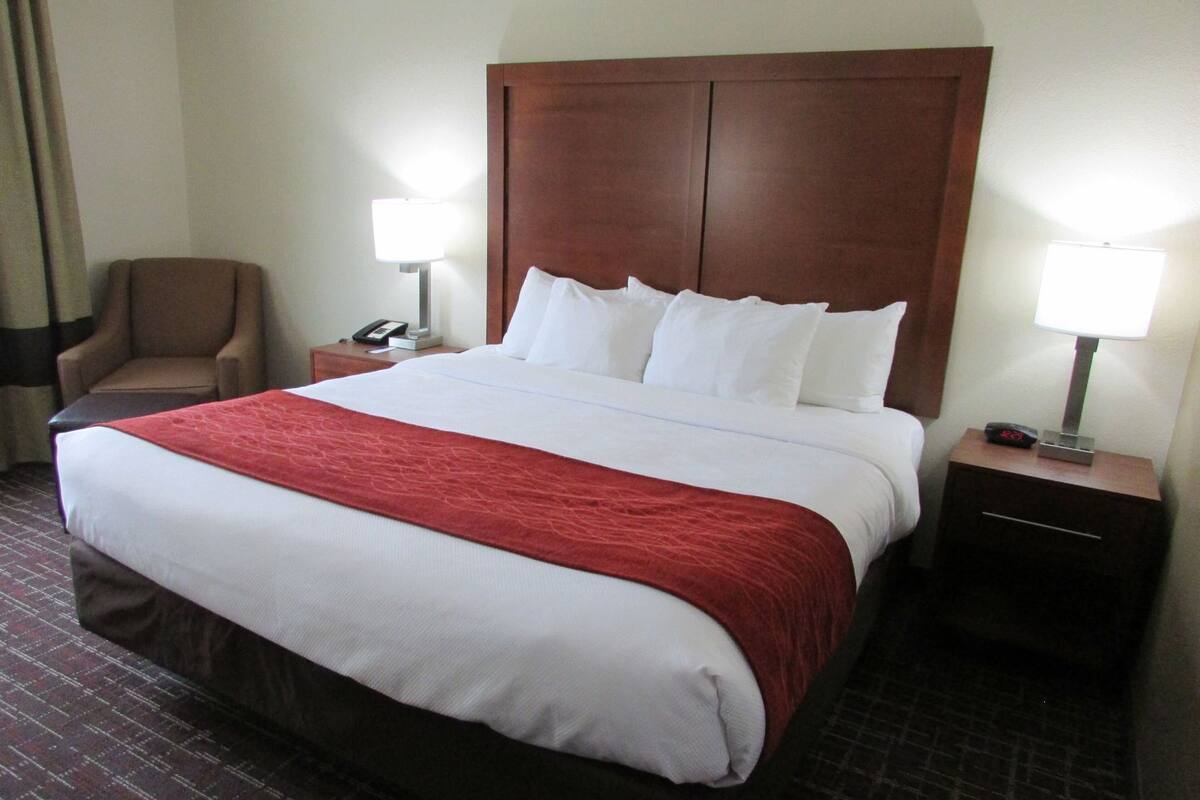 Premium bedding, desk, laptop workspace, blackout curtains