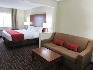 Premium bedding, desk, laptop workspace, blackout drapes