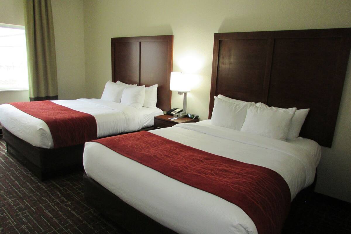 Premium bedding, desk, laptop workspace, blackout curtains