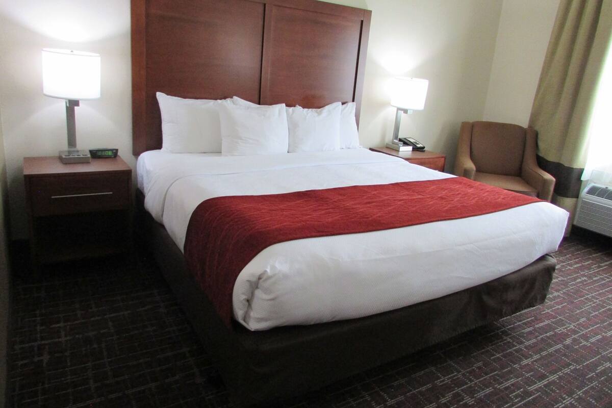 Premium bedding, desk, laptop workspace, blackout curtains