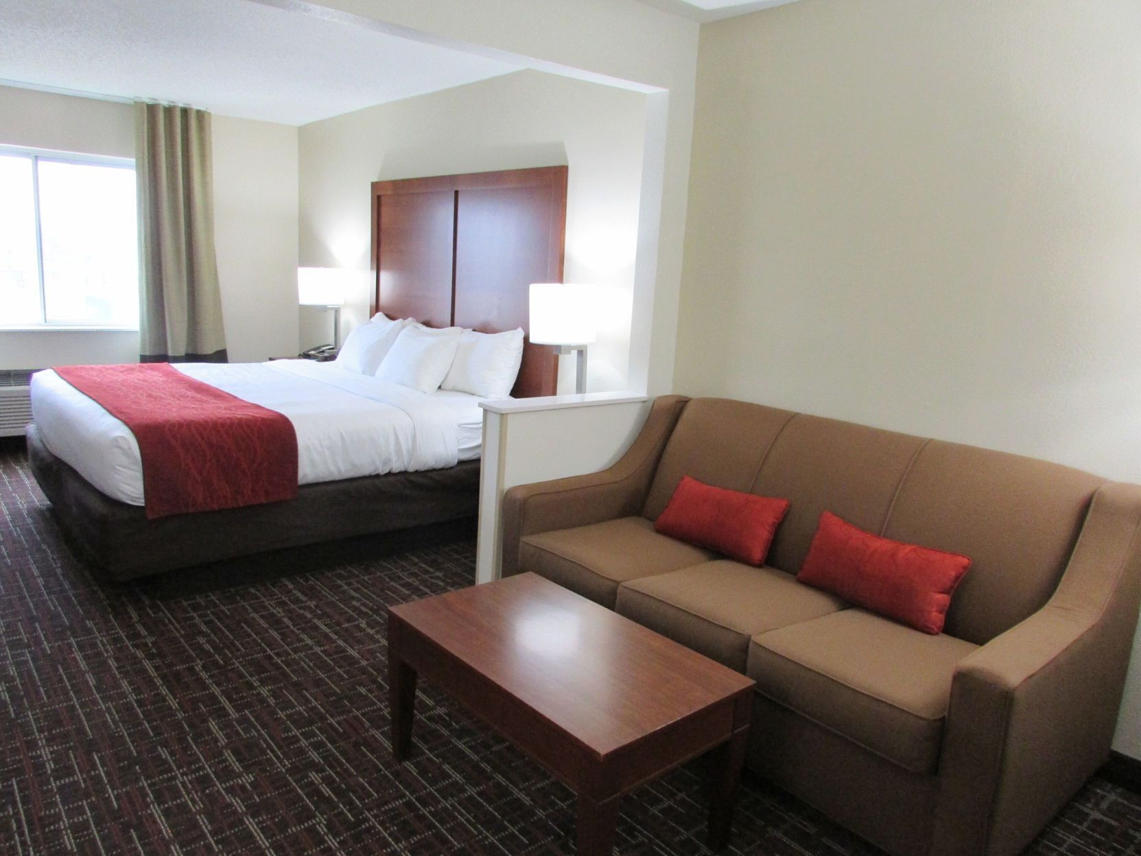 Premium bedding, desk, laptop workspace, blackout drapes