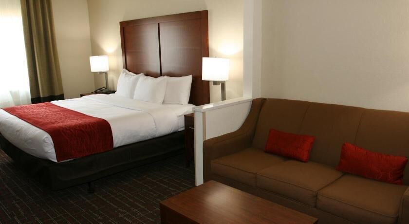 Premium bedding, desk, laptop workspace, blackout drapes