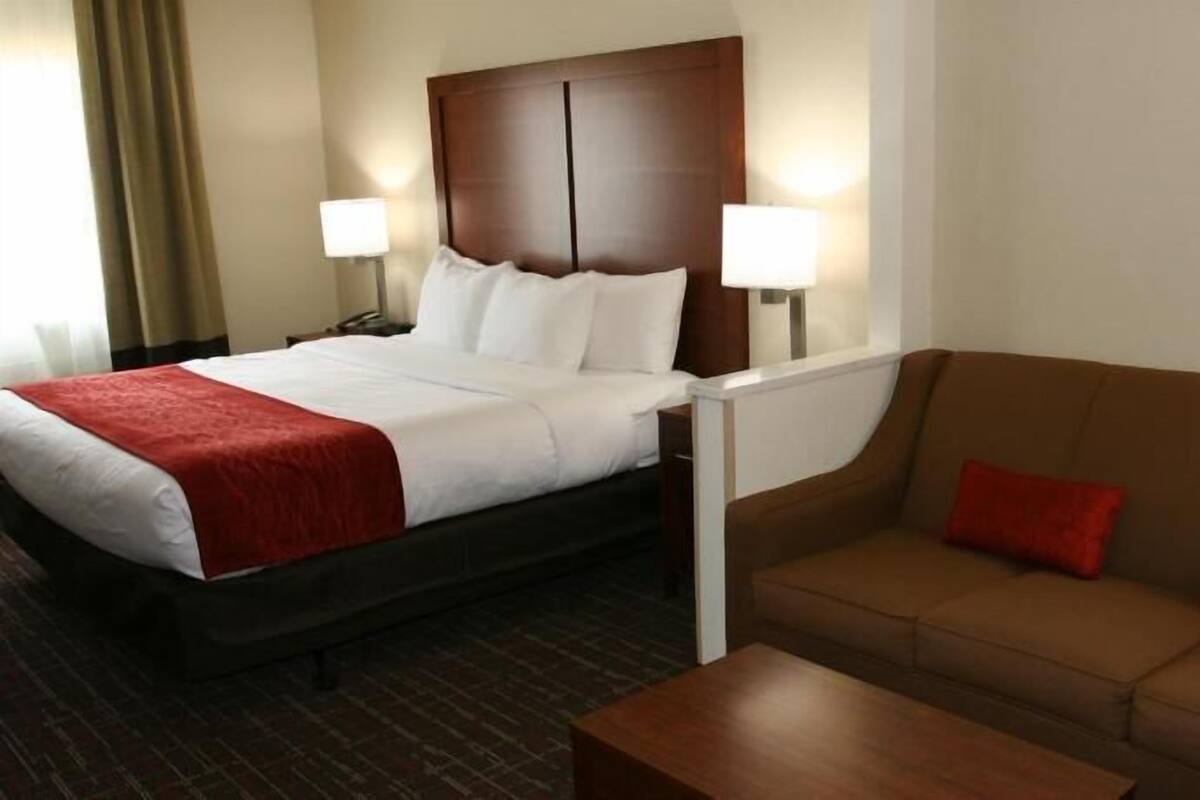 Premium bedding, desk, laptop workspace, blackout curtains