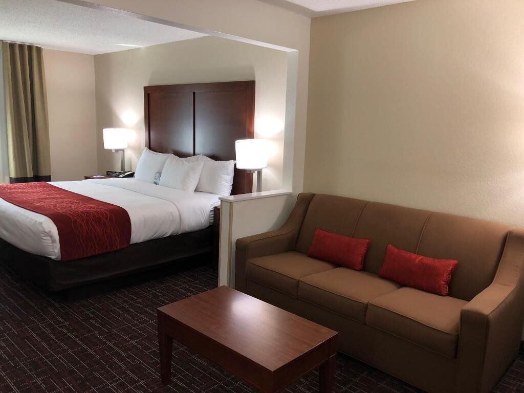 Premium bedding, desk, laptop workspace, blackout drapes