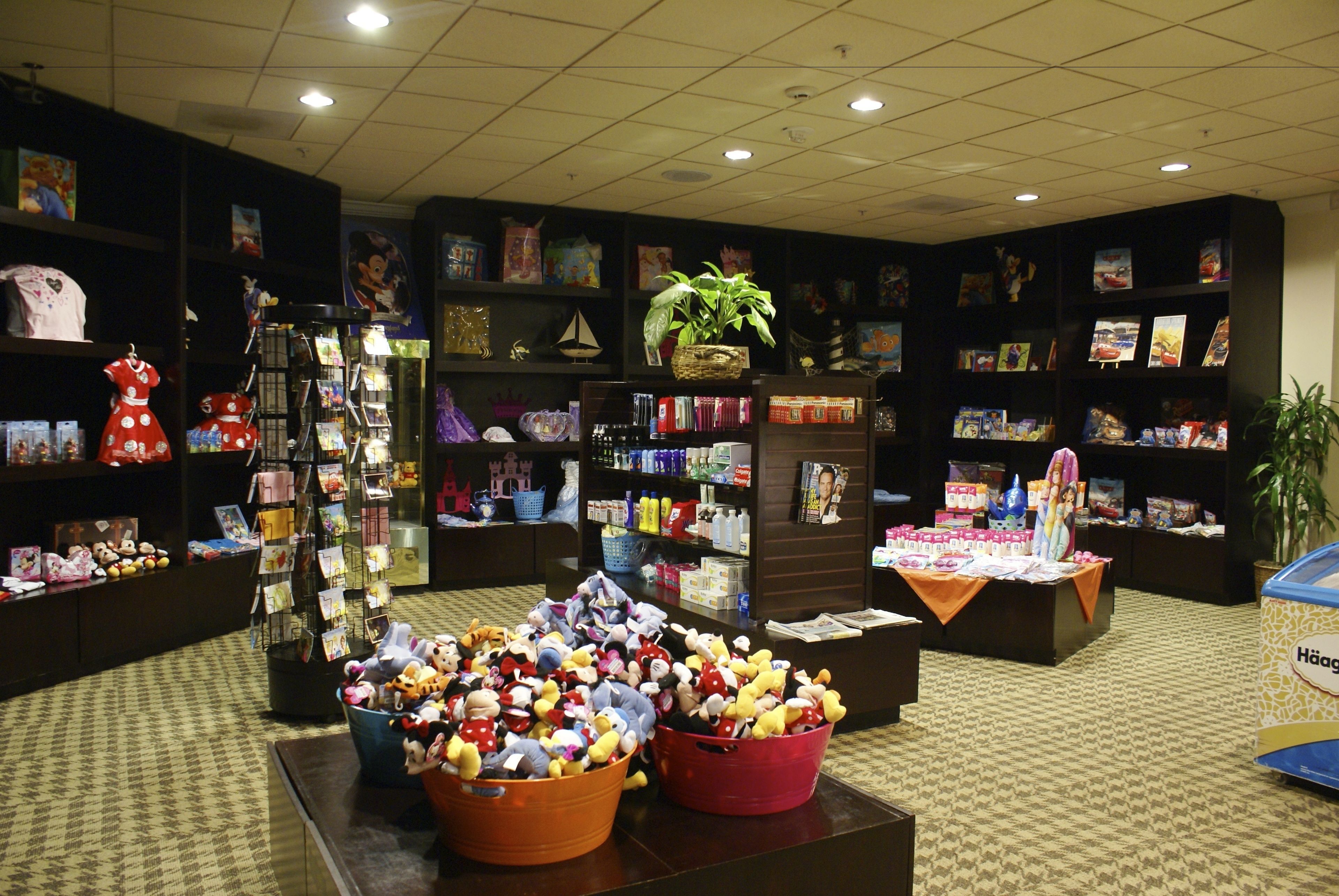 A bookstore with shelves of books and various merchandise, including plush toys and greeting cards.