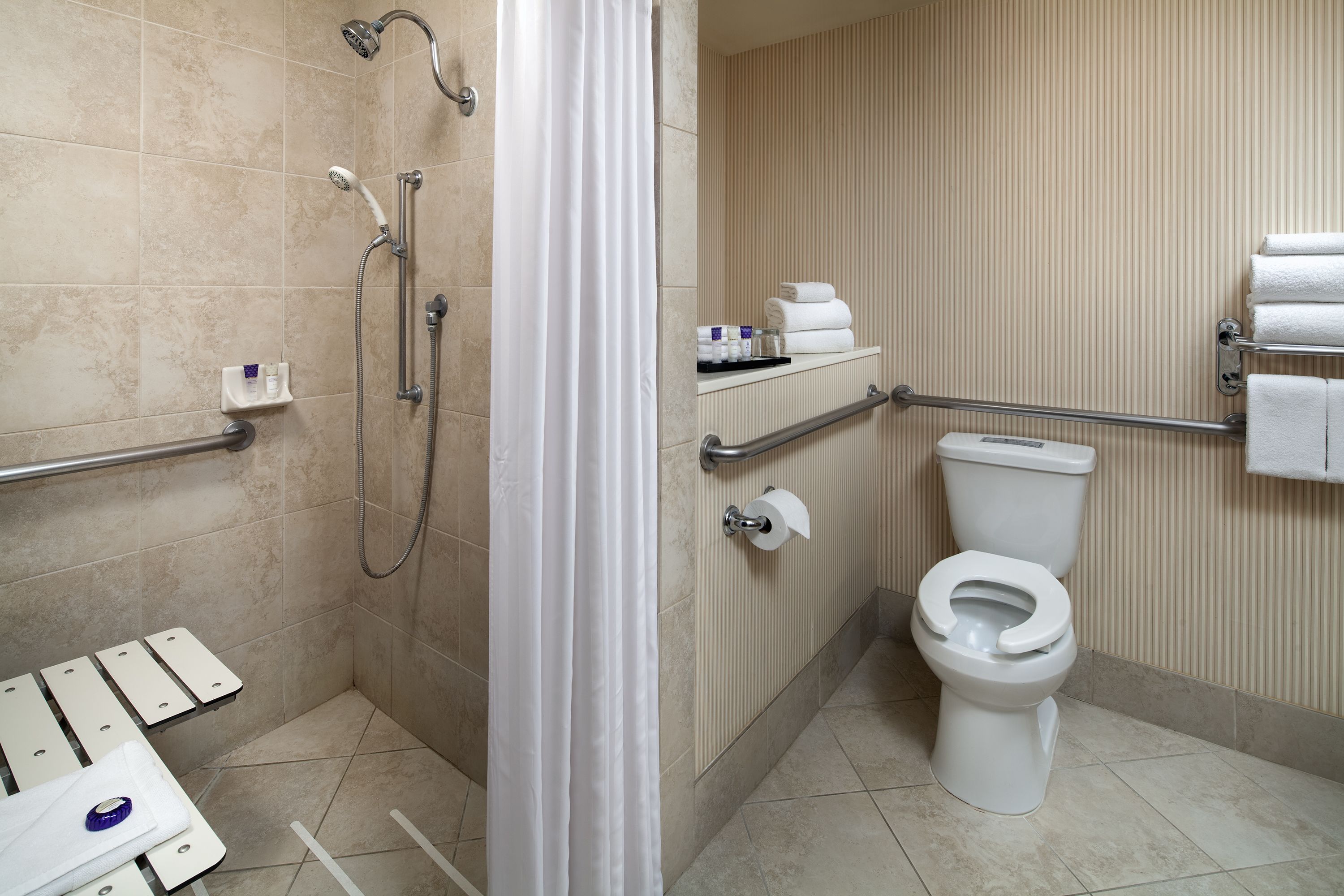 combined shower/bathtub, hair dryer, towels, soap