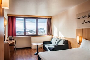Premium bedding, desk, laptop workspace, blackout curtains