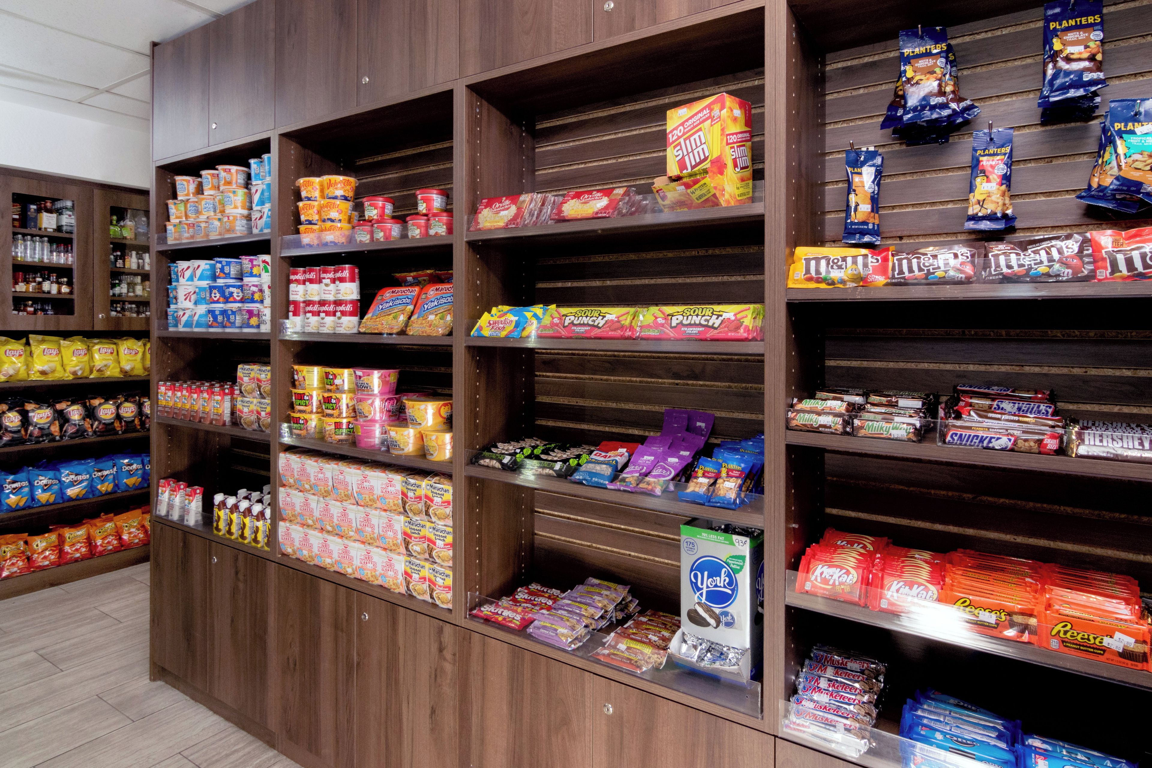 A snack aisle with various packaged goods.