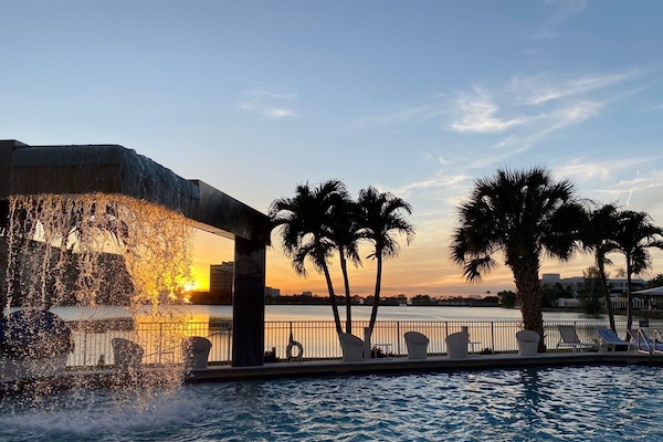 Outdoor pool, open 7:00 AM to 8:00 PM, pool loungers