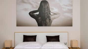 Hypo-allergenic bedding, desk, laptop workspace, blackout drapes