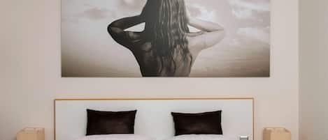 Hypo-allergenic bedding, desk, laptop workspace, blackout drapes