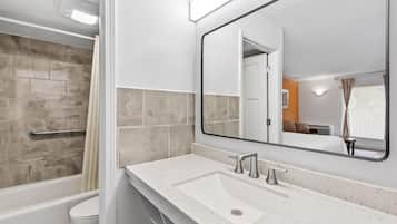 One King Bed, Non-Smoking | Bathroom | Bathtub, free toiletries, hair dryer, towels