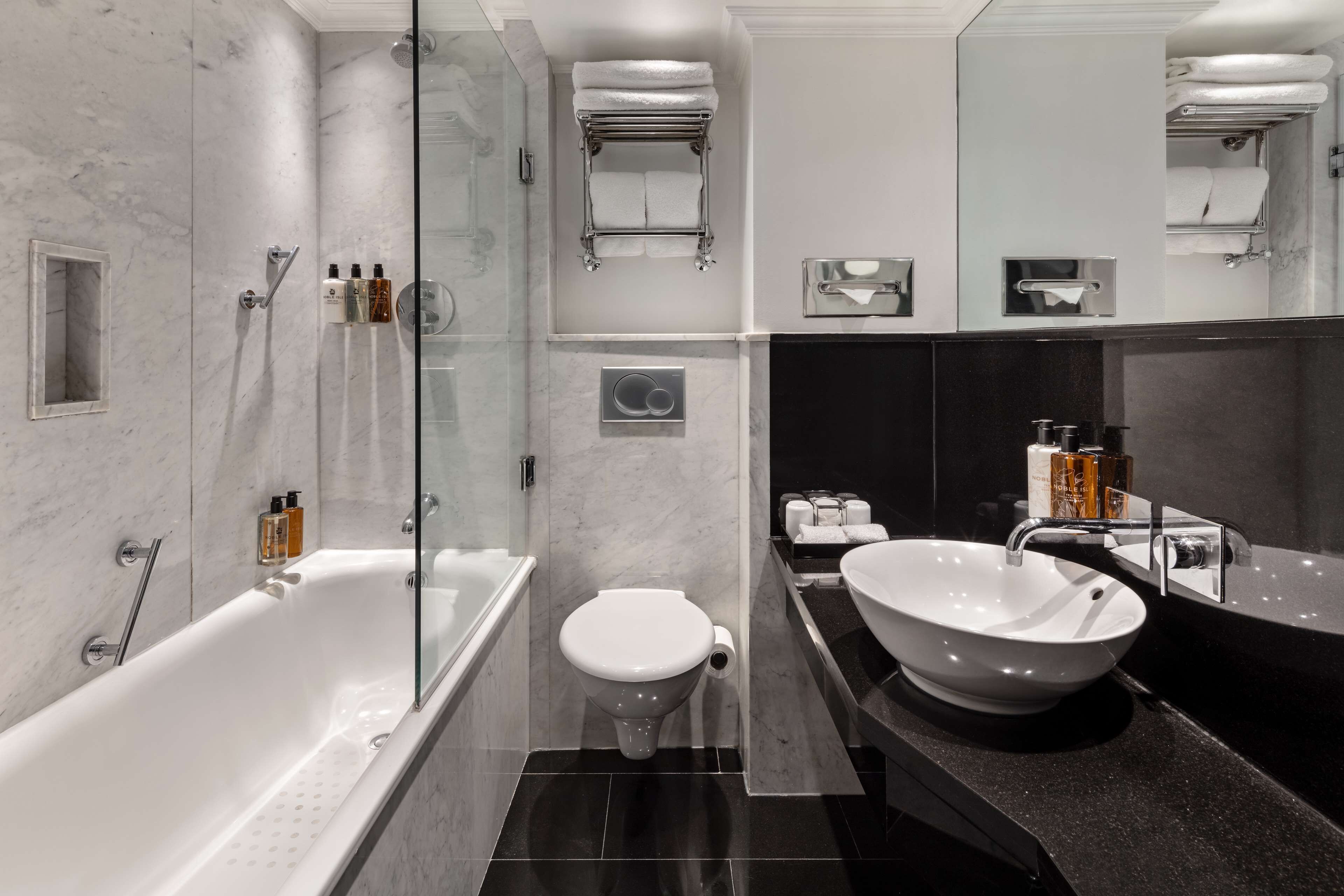 designer toiletries, hair dryer, towels