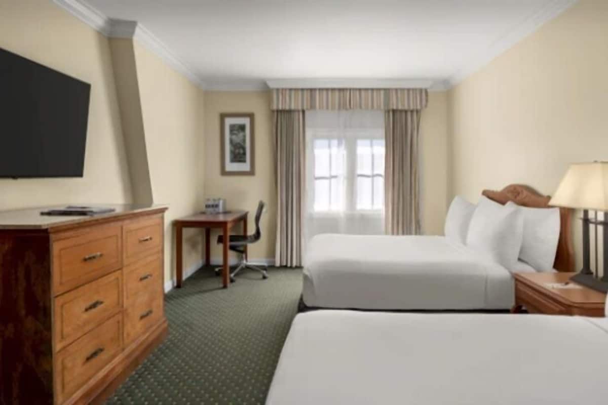 Premium bedding, down comforters, pillowtop beds, minibar