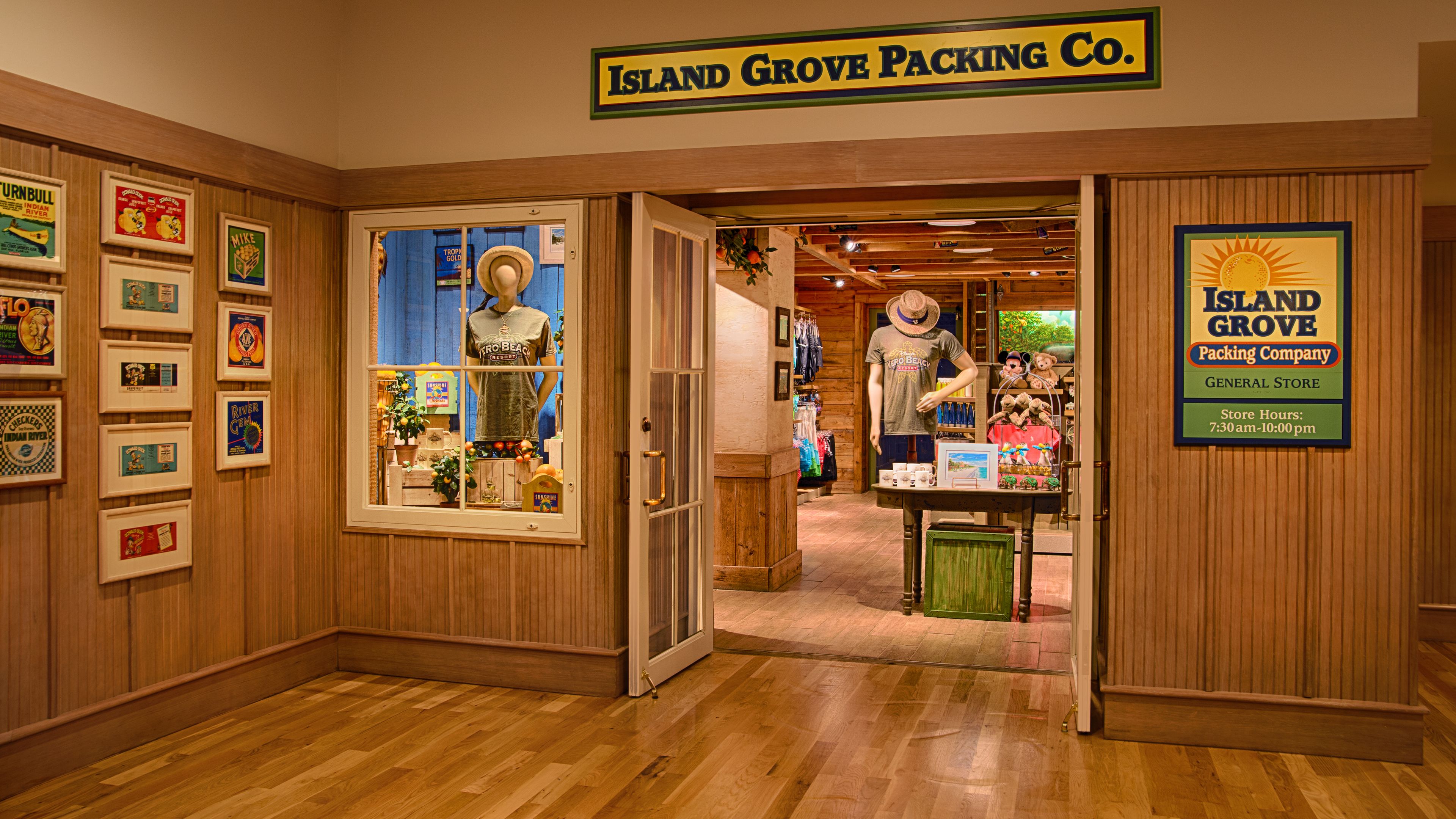 A store interior with wooden paneling, a sign for Island Grove Packing Co., and various items on display including a mannequin and souvenirs.