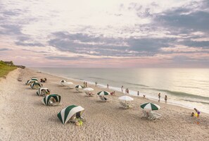 Private beach, white sand, sun loungers, beach umbrellas