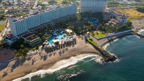 A resort with multiple buildings, a beach, and a pool area. - Sheraton Buganvilias Puerto Vallarta  (Puerto Vallarta)