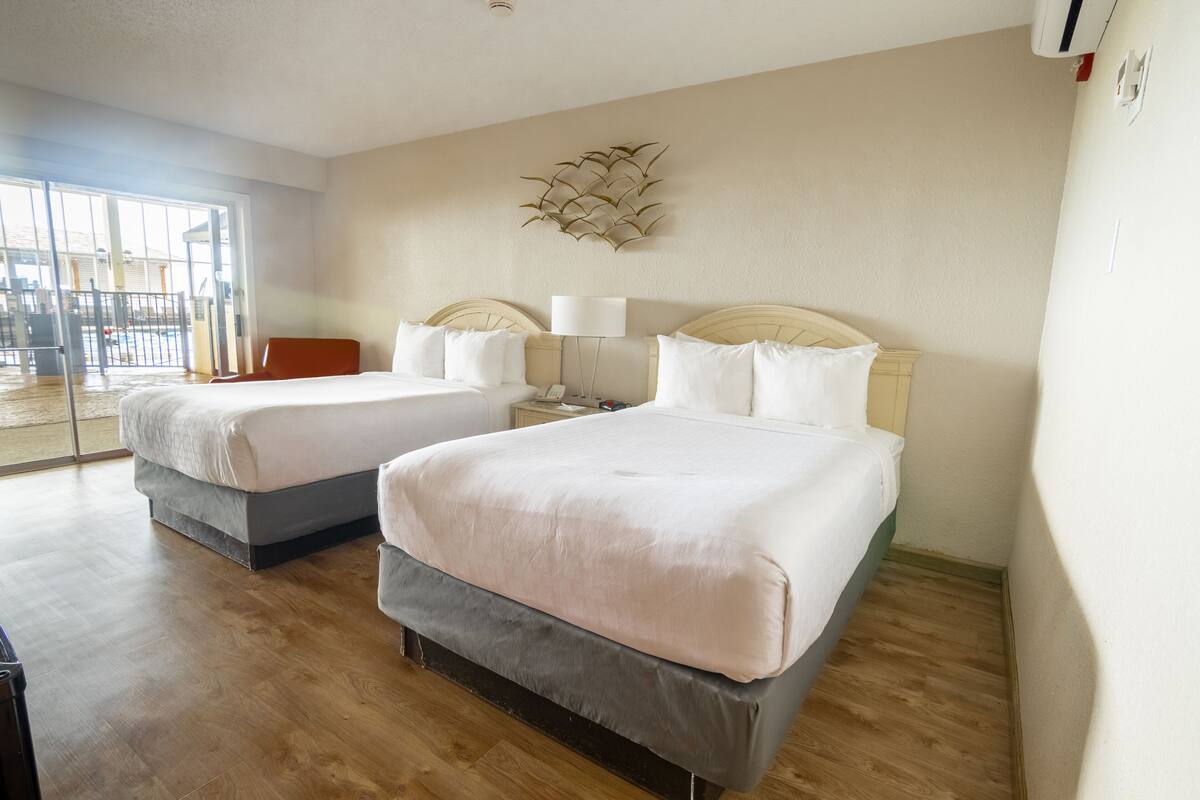 Room, 2 Double Beds, Pool View | Desk, laptop workspace, blackout drapes, iron/ironing board