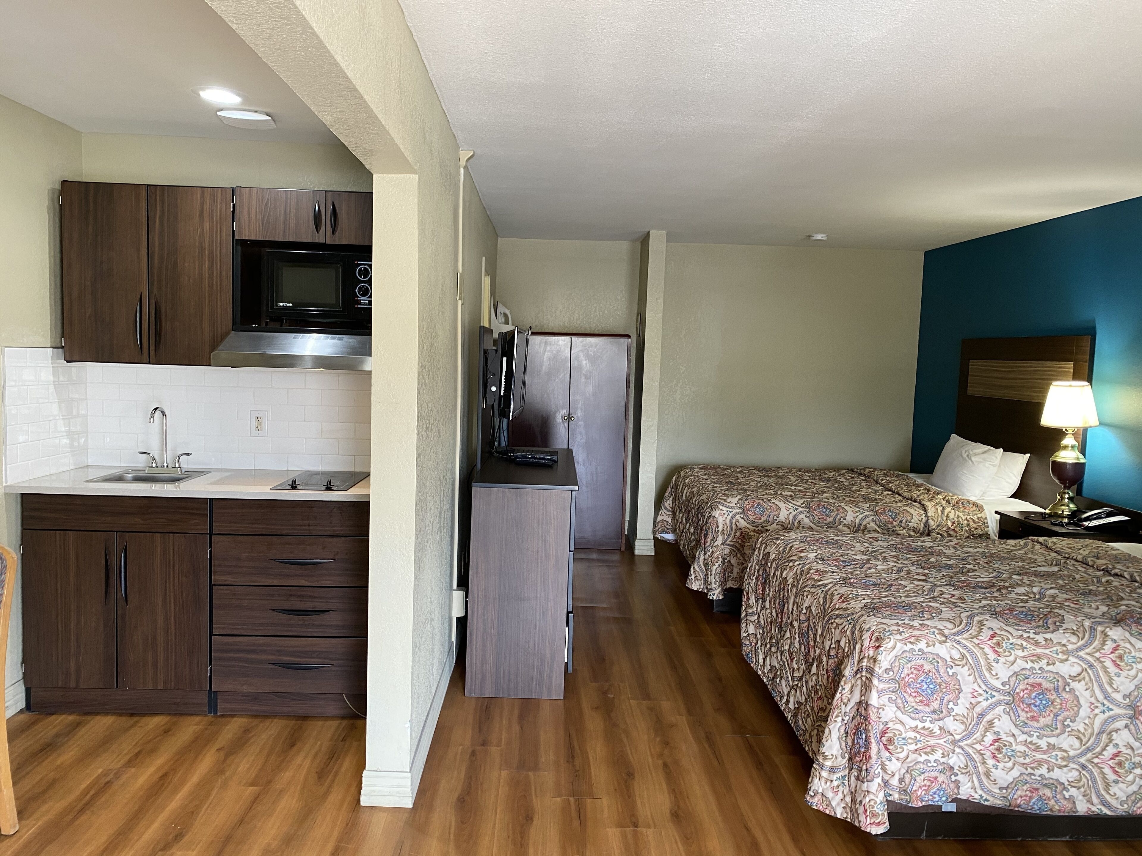 Standard Room, 2 Double Beds | Private kitchen | Fridge, microwave, coffee/tea maker