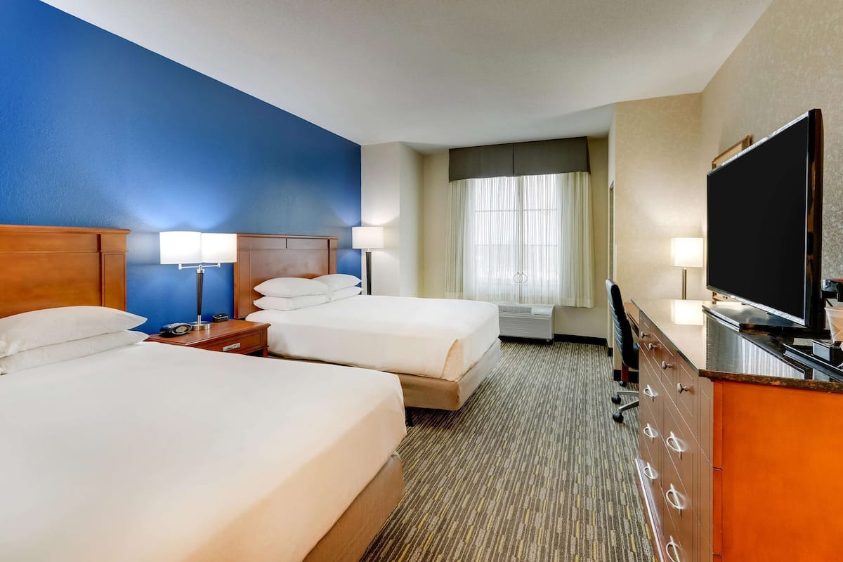 deluxe room, 2 queen beds, accessible, refrigerator & microwave (tub) | desk, blackout curtains, iron/ironing board, free cots/infant beds