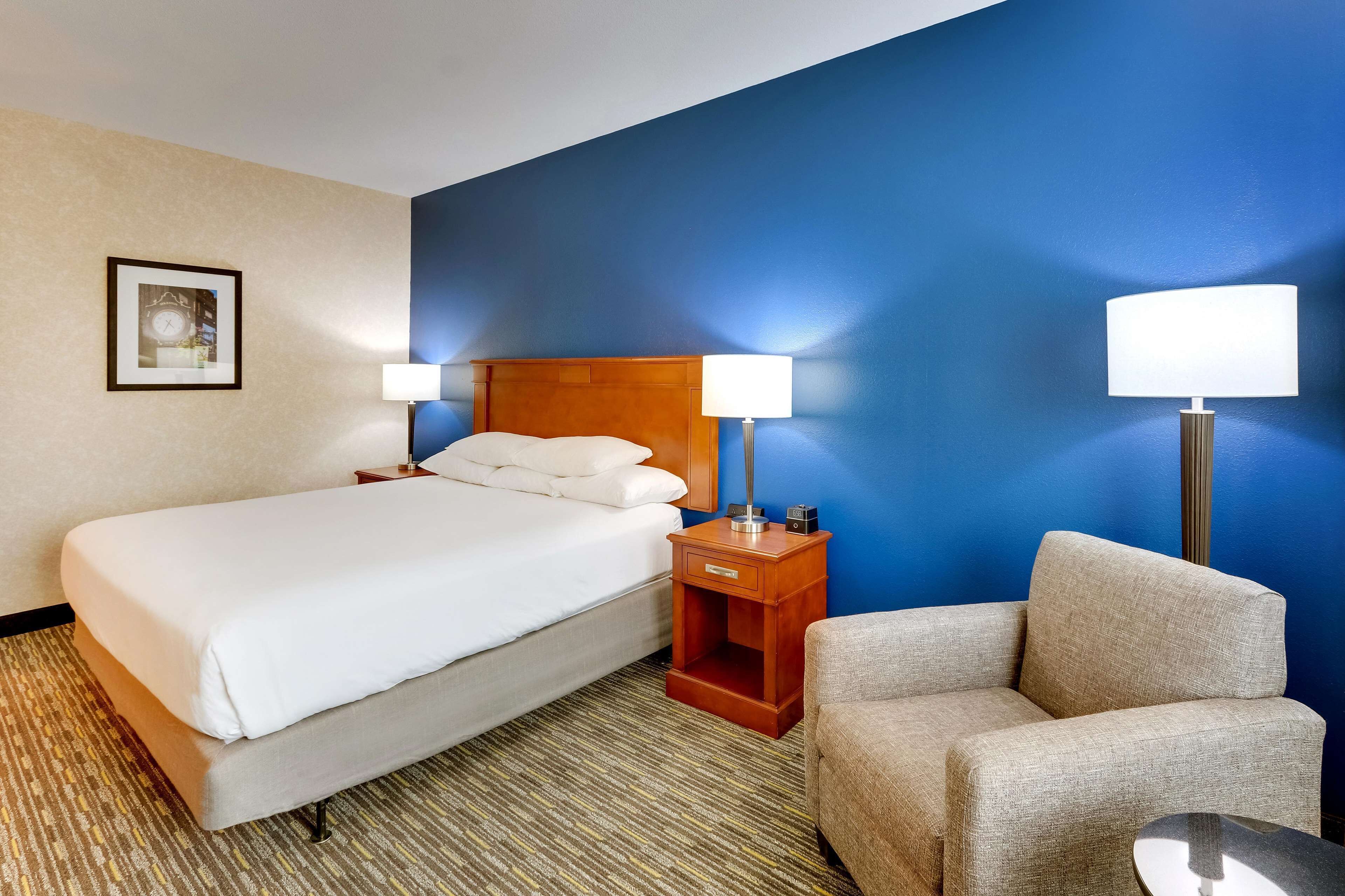 deluxe room, 1 king bed, accessible, refrigerator & microwave (roll in shower) | desk, blackout curtains, iron/ironing board, free cots/infant beds