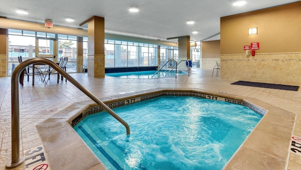 An indoor swimming pool with a 3 FT depth marker, a metal ladder, and a tiled floor. - Drury Inn & Suites Sikeston, MO (Sikeston)