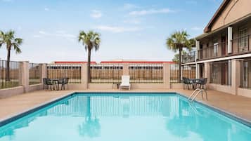 Outdoor pool, open 9:00 AM to 9:00 PM, pool loungers