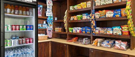 A snack and beverage vending area with a variety of snacks and drinks.