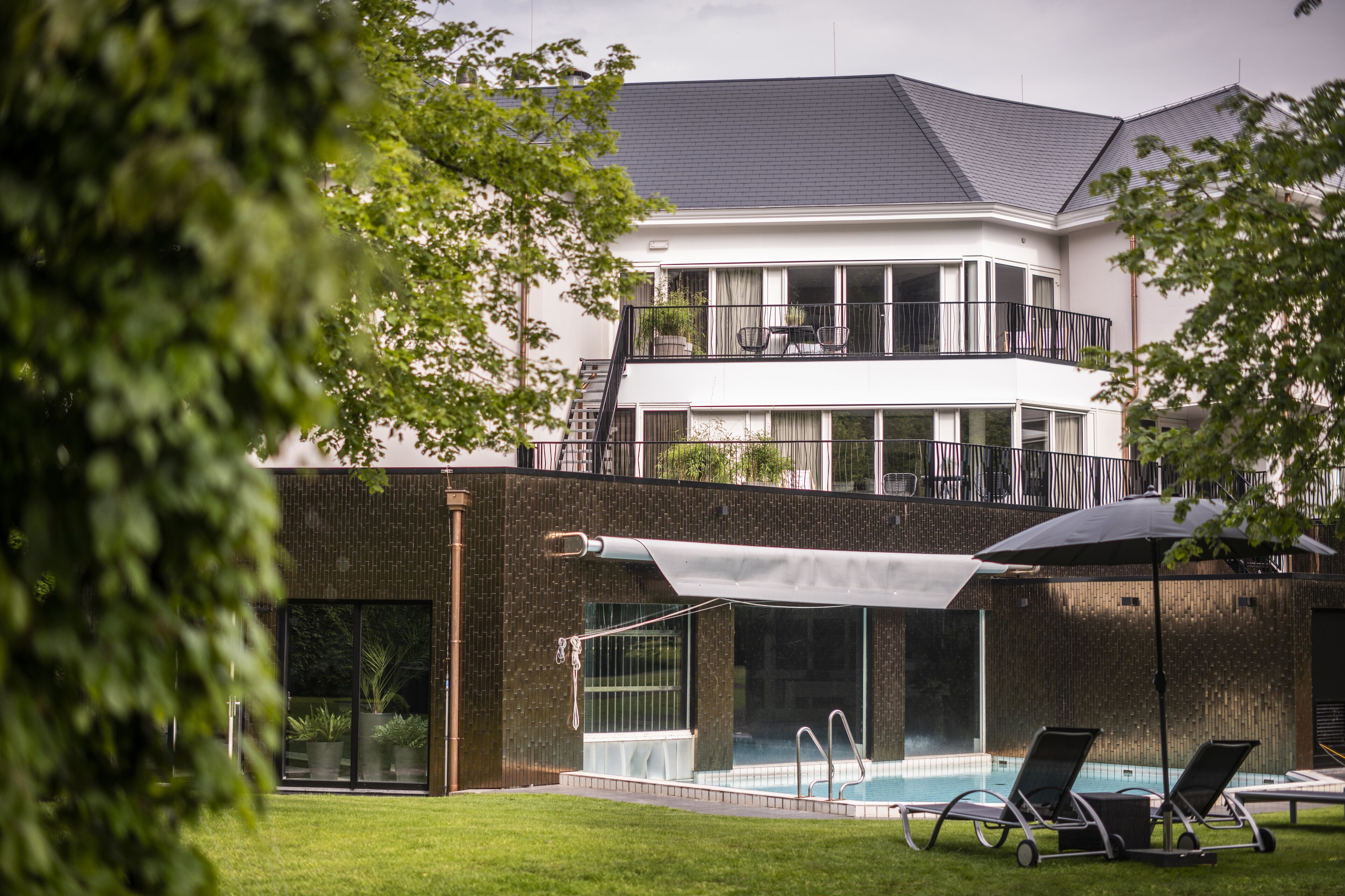 indoor pool, outdoor pool, pool umbrellas, pool loungers