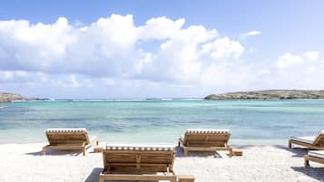 Private beach, beach umbrellas, beach towels, snorkeling