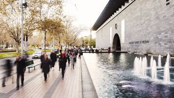 A walkway with a water feature and a building labeled "National Gallery of Victoria."