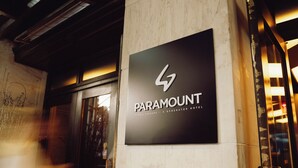 A sign for Paramount Times Square - A Generator Hotel.