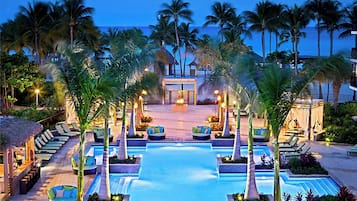 2 outdoor pools, open 7 AM to 7 PM, cabanas (surcharge), pool umbrellas
