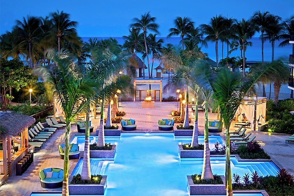 2 outdoor pools, open 7 AM to 7 PM, cabanas (surcharge), pool umbrellas