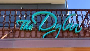 A sign with the words "The Dylan" in stylized lettering.