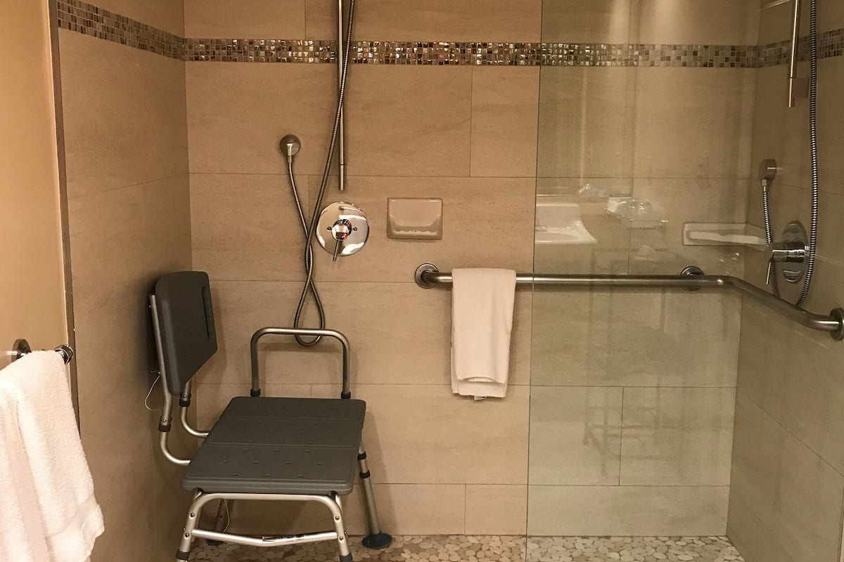 deluxe double room, 2 queen beds | bathroom | rainfall showerhead, free toiletries, hair dryer, towels